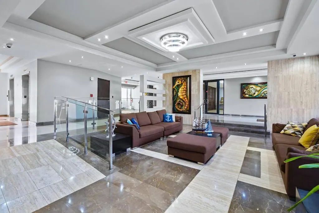 Апартаменты Luxury Beachfront Condo With Pool And Beachview Balcony Сан-Хуан